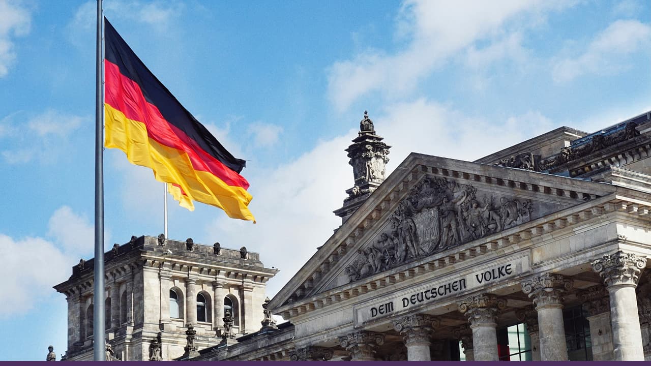 German parliament building in Berlin with the national flag