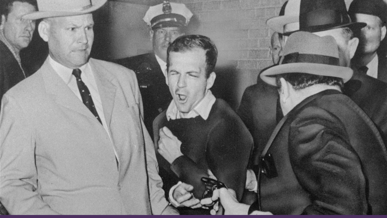 Jack Ruby shoots Lee Harvey Oswald, the accused assassin of President John F. Kennedy, as he is being transferred from the Dallas city jail.