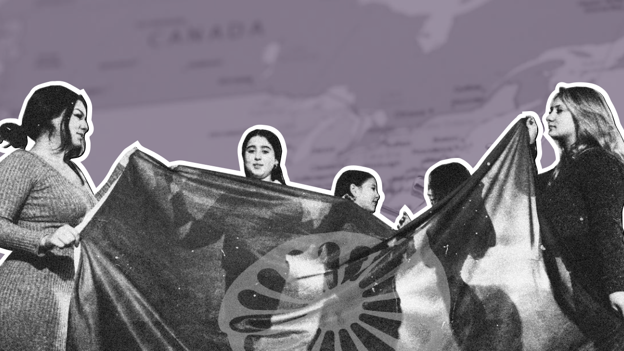 Group of Romani individuals holding a Romani flag during a public gathering, symbolizing unity and cultural identity. 
